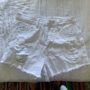 white ripped jean shorts
